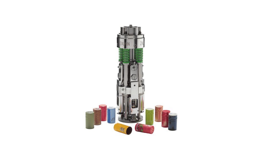 Zalkin ROPP Capping Head with several coloured ROPP caps on a white background - bottle capping machines and cap handling systems