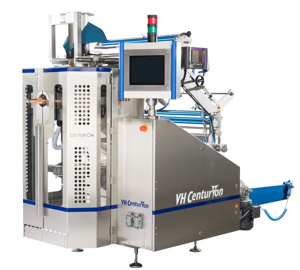 A large industrial VH CenturTon machine boasts a sleek metal exterior and features a vertical packaging system with a touch screen display, various controls, and input/output sections for efficient material processing. The equipment is expertly designed for automated packaging tasks.
