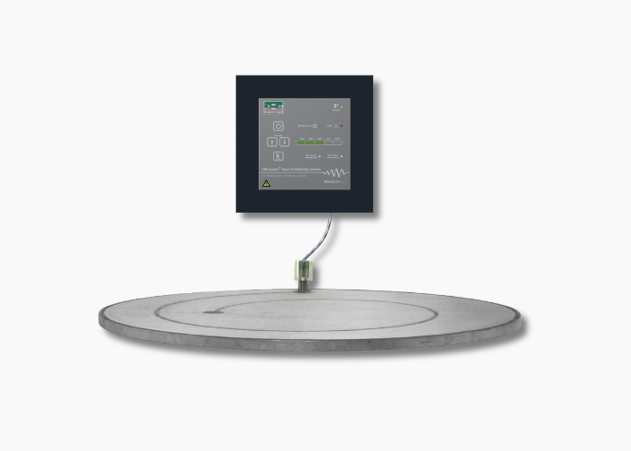 A round electronic floor scale, perfect for any bakery, with a digital control panel mounted above it and connected by a cable, set against a plain white background.